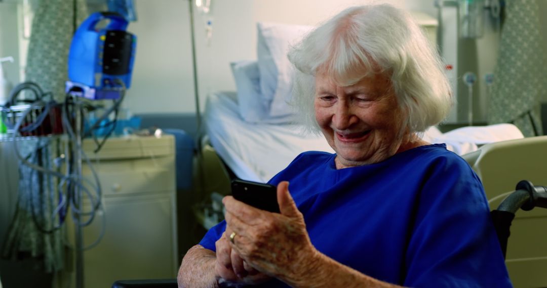 Elderly Woman Using Smartphone in Hospital Room - Free Images, Stock Photos and Pictures on Pikwizard.com