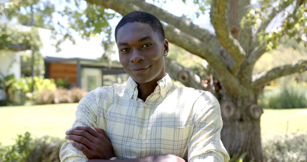 Confident Man Enjoying Sunny Day in Park