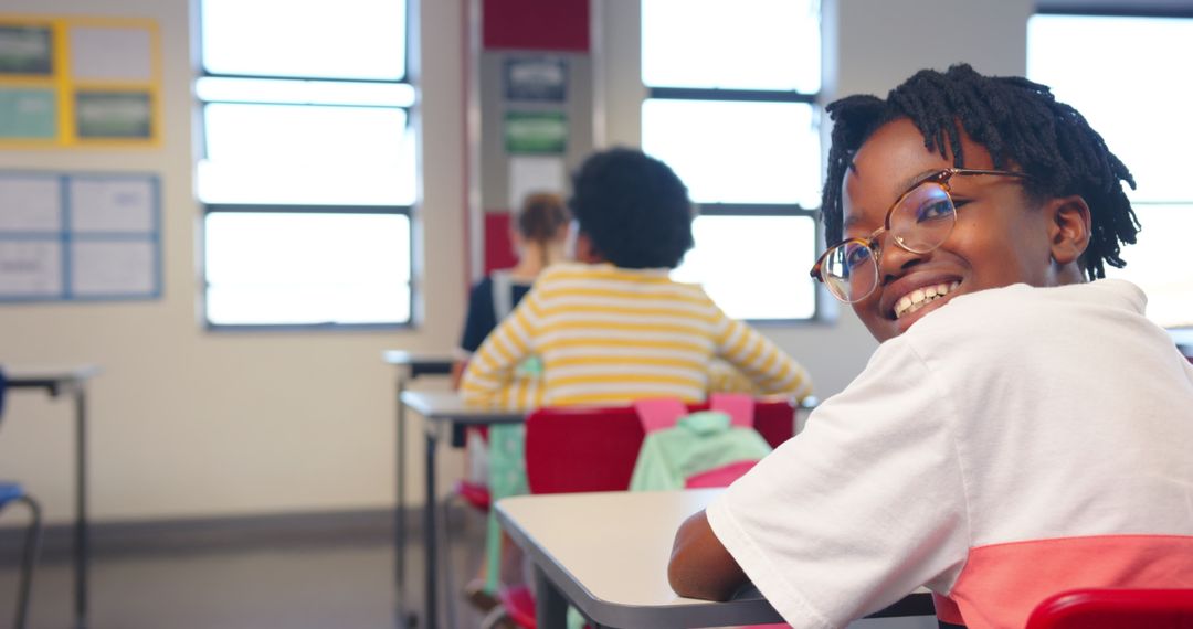 Diverse Students Engaging in Classroom Learning with Red Chairs