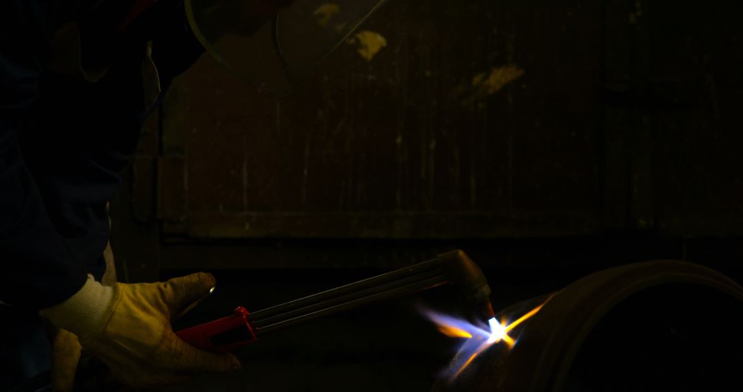 Welder Working With Intense Focus in Industrial Environment - Free Images, Stock Photos and Pictures on Pikwizard.com