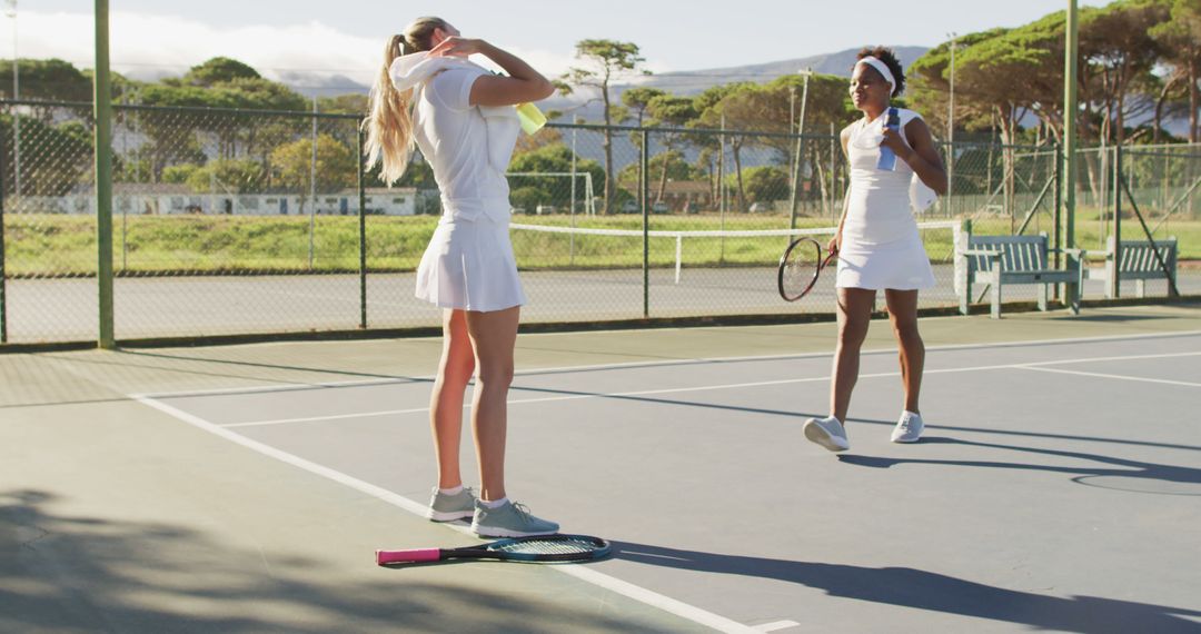 Female Tennis Players Celebrating Victory on Tennis Court - Free Images, Stock Photos and Pictures on Pikwizard.com