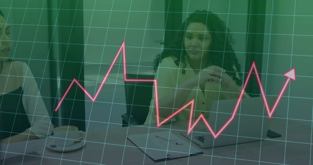 Graph Showing Financial Data with Colleagues Discussing Business