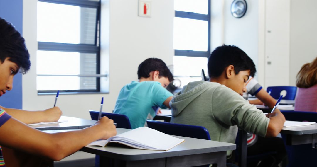 Students Taking Exam in Classroom Setting - Free Images, Stock Photos and Pictures on Pikwizard.com