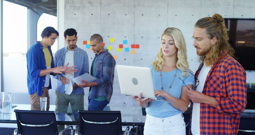 Young Professionals Collaborating in a Modern Office Environment