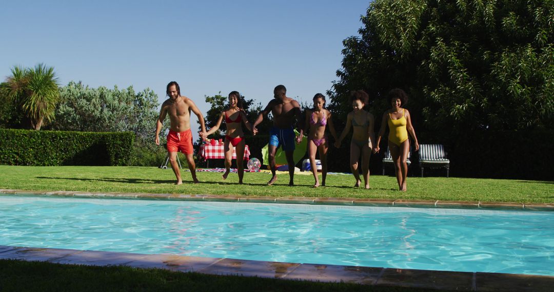 Friends Jumping into Swimming Pool on Sunny Day - Free Images, Stock Photos and Pictures on Pikwizard.com