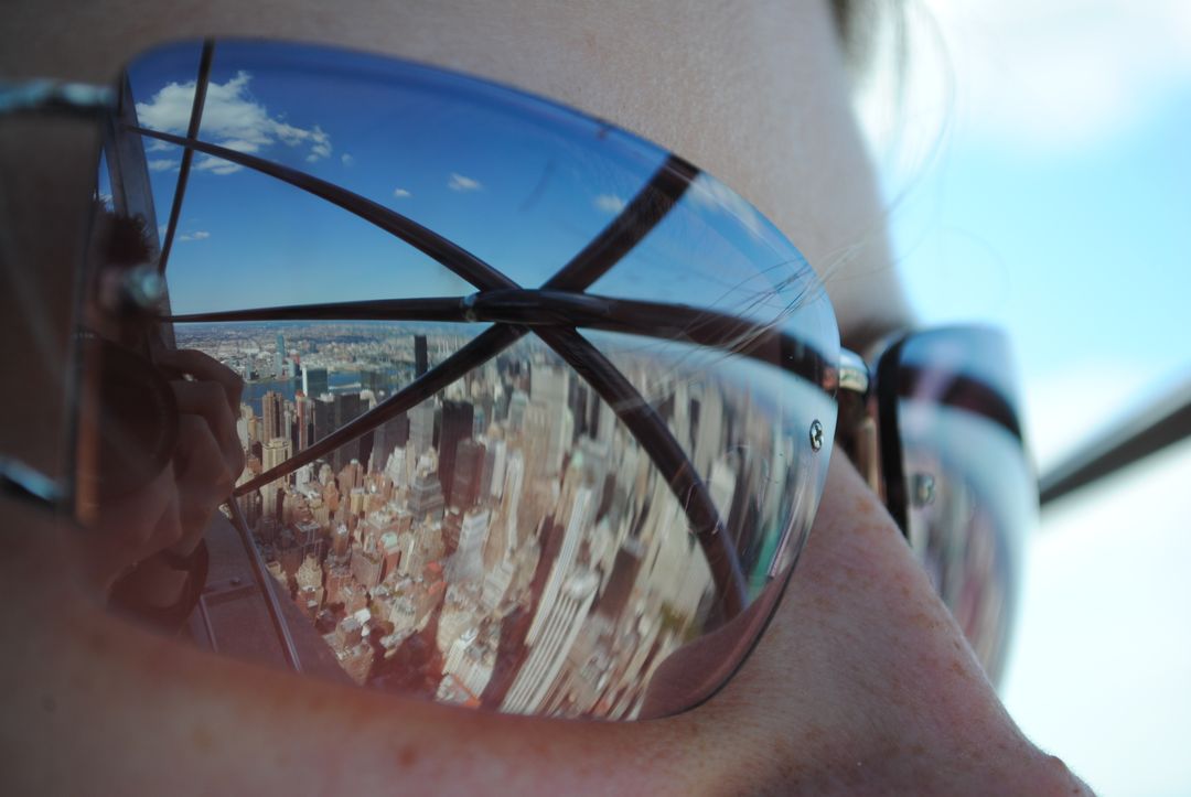 City Skyline Reflected in Sunglasses on Sunny Day - Free Images, Stock Photos and Pictures on Pikwizard.com