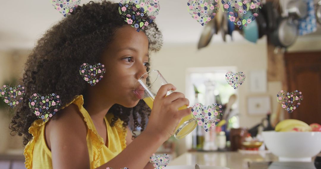 Curly Haired Girl Sipping Juice with Digital Hearts