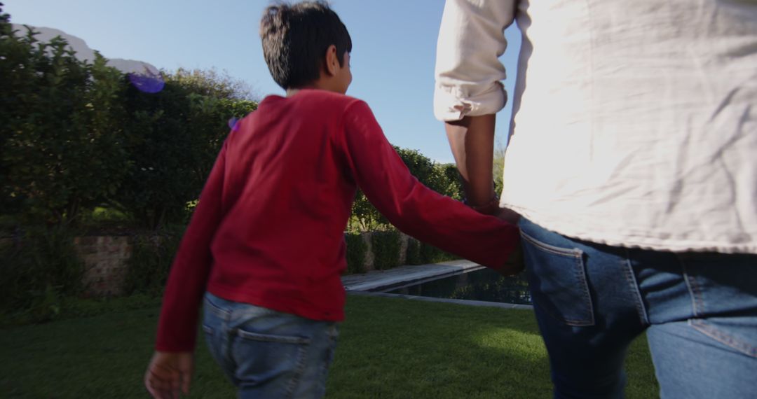 Father and Son Bonding in Serene Backyard Setting