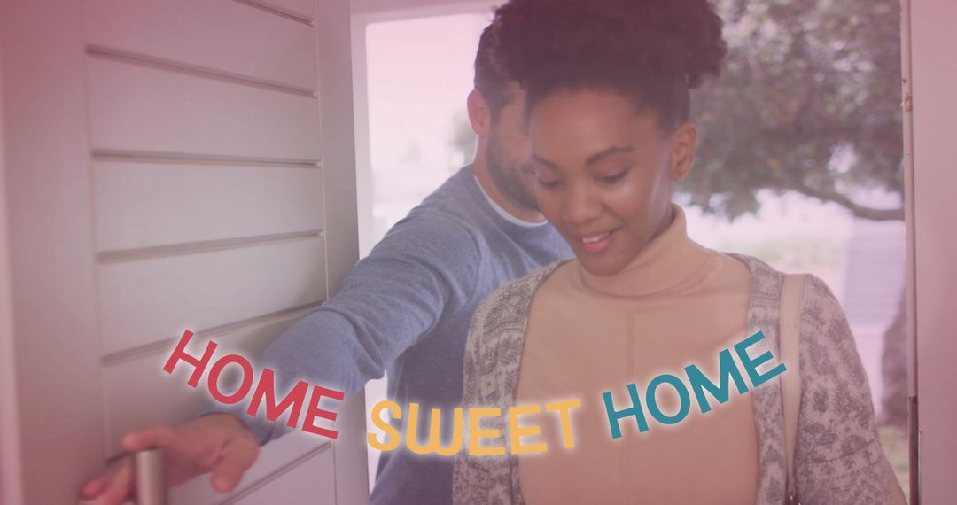 Happy Couple Entering New Home with Warm Welcome