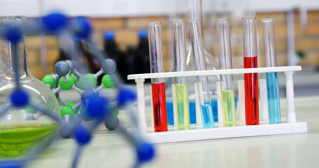 Colorful Chemical Solutions in Laboratory Test Tubes on White Rack - Free Images, Stock Photos and Pictures on Pikwizard.com