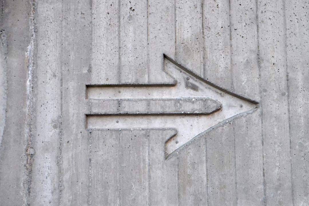 Concrete Wall with Carved Arrow Design - Free Images, Stock Photos and Pictures on Pikwizard.com
