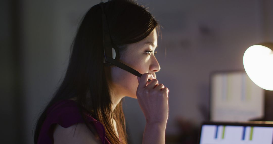 Image of asian female consultant working late in office - Free Images, Stock Photos and Pictures on Pikwizard.com