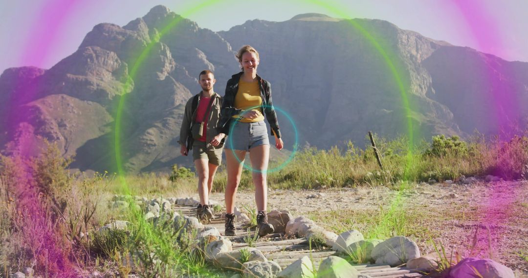 Couple Hiking Scenic Mountain Trail with Colorful Lens Flare