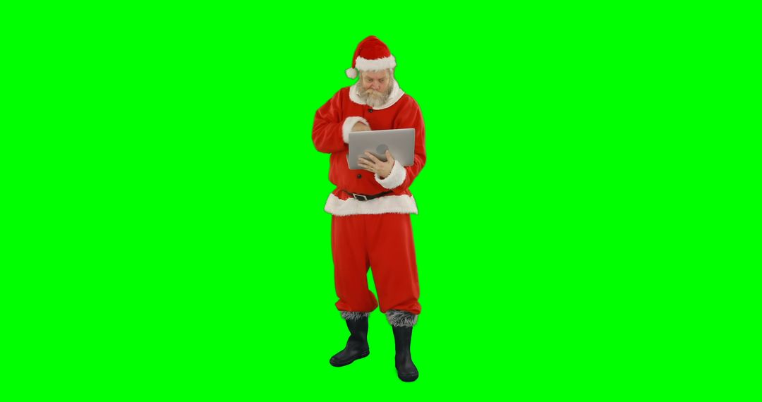 Santa Claus Checking Tablet on Green Screen Background - Free Images, Stock Photos and Pictures on Pikwizard.com