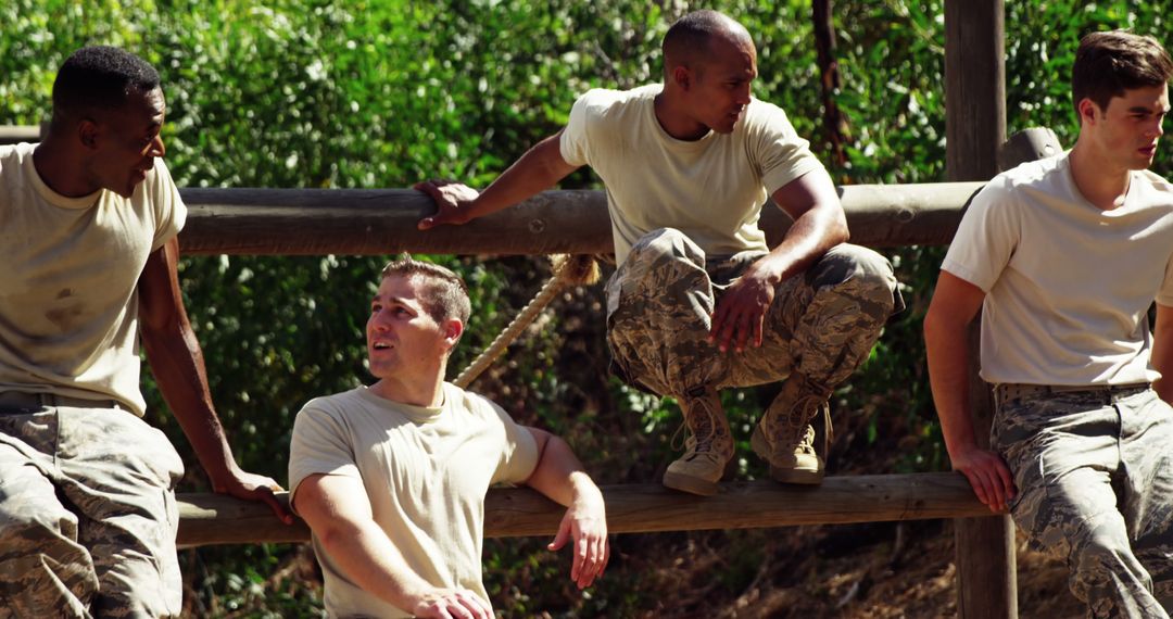 Military Recruits Engaging in Team Building at Boot Camp Course