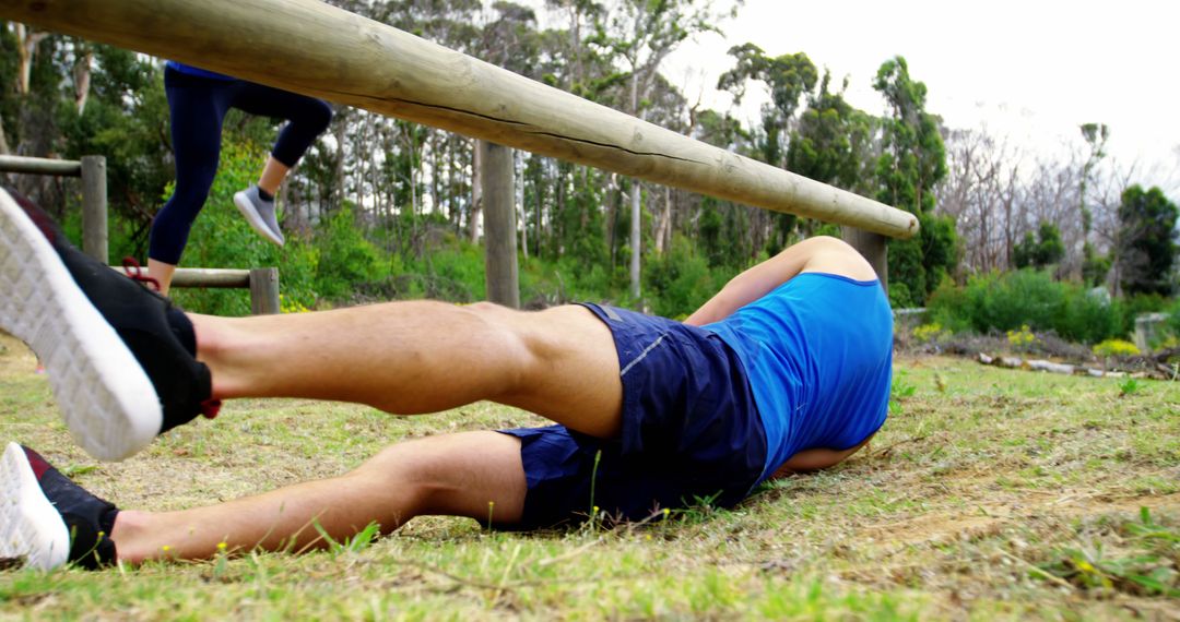 Man Falling During Obstacle Course Training Outdoors - Free Images, Stock Photos and Pictures on Pikwizard.com