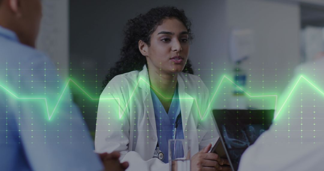 Doctor Collaborates on Medical Teamwork with Technology