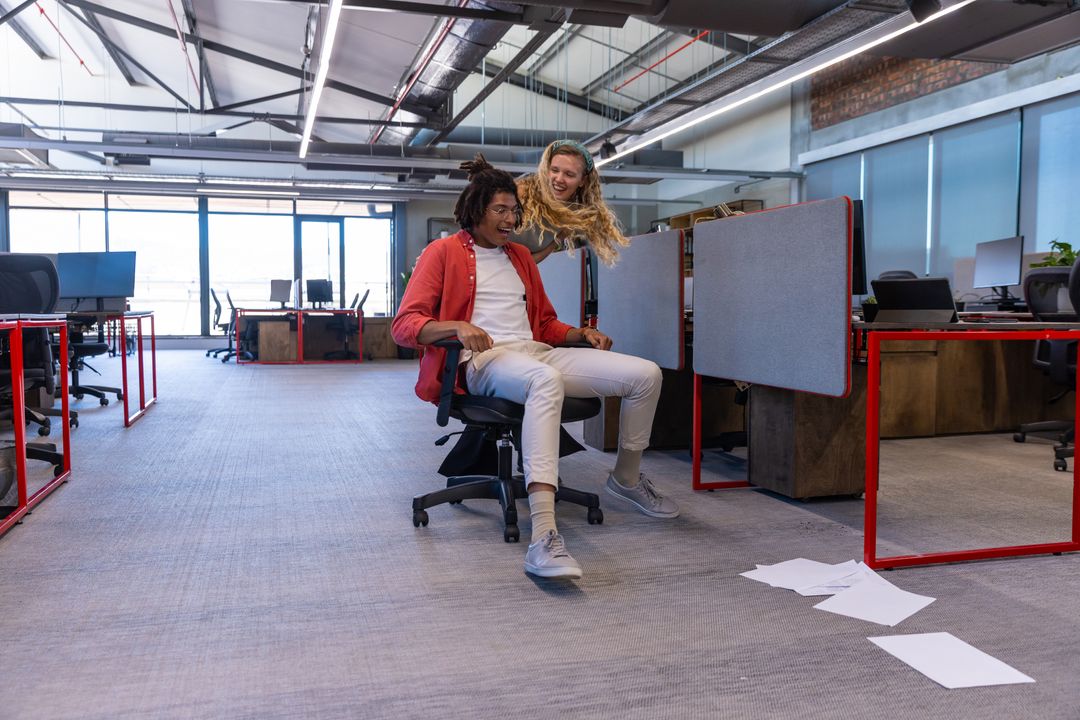 Coworkers Having Fun in Modern Open-Plan Office
