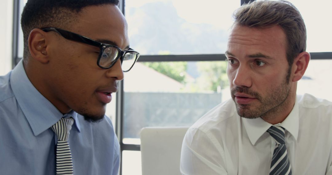 Diverse Businessmen Collaborating in Office Setting