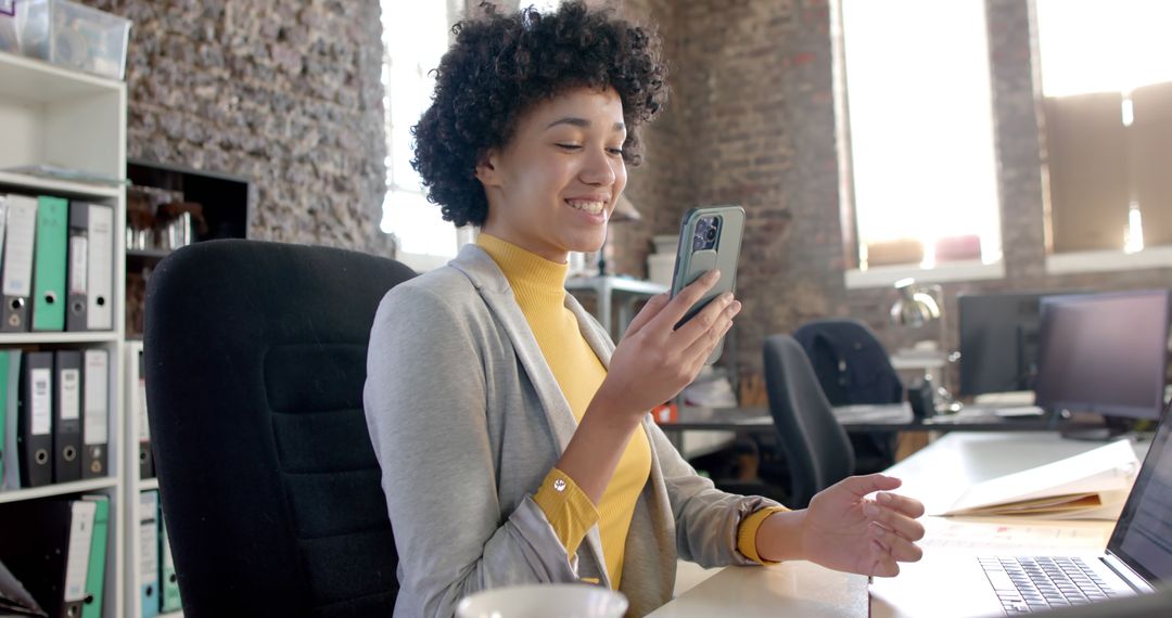 Smiling Black Woman Using Smartphone in Modern Office - Free Images, Stock Photos and Pictures on Pikwizard.com