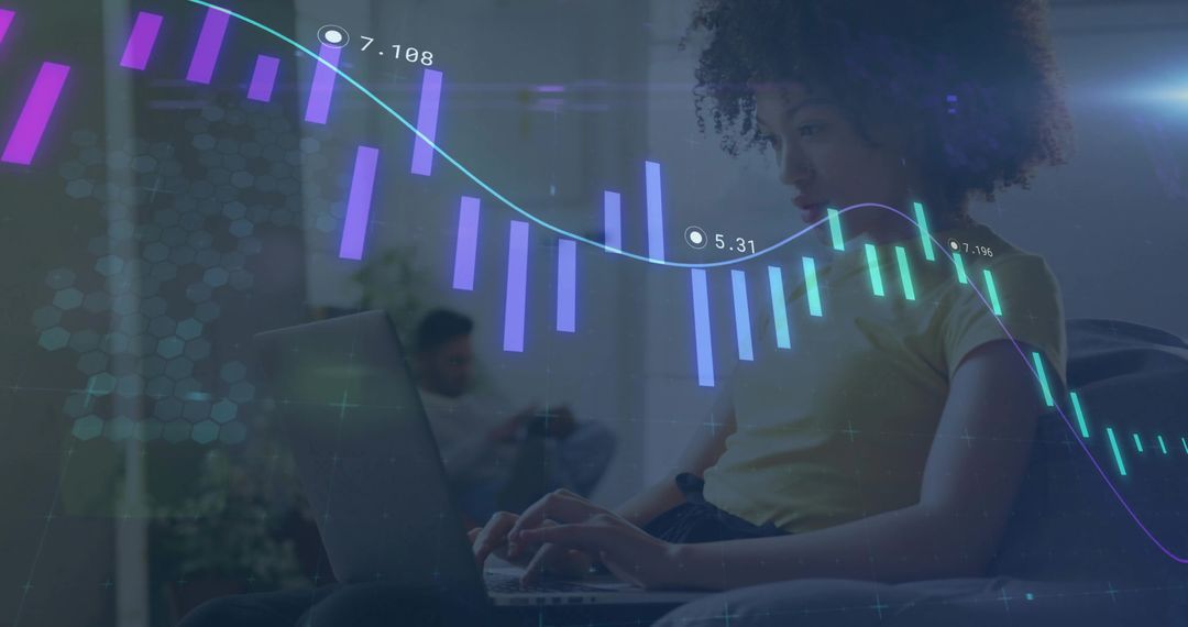 Young woman working on laptop with augmented reality finance charts overlay at home