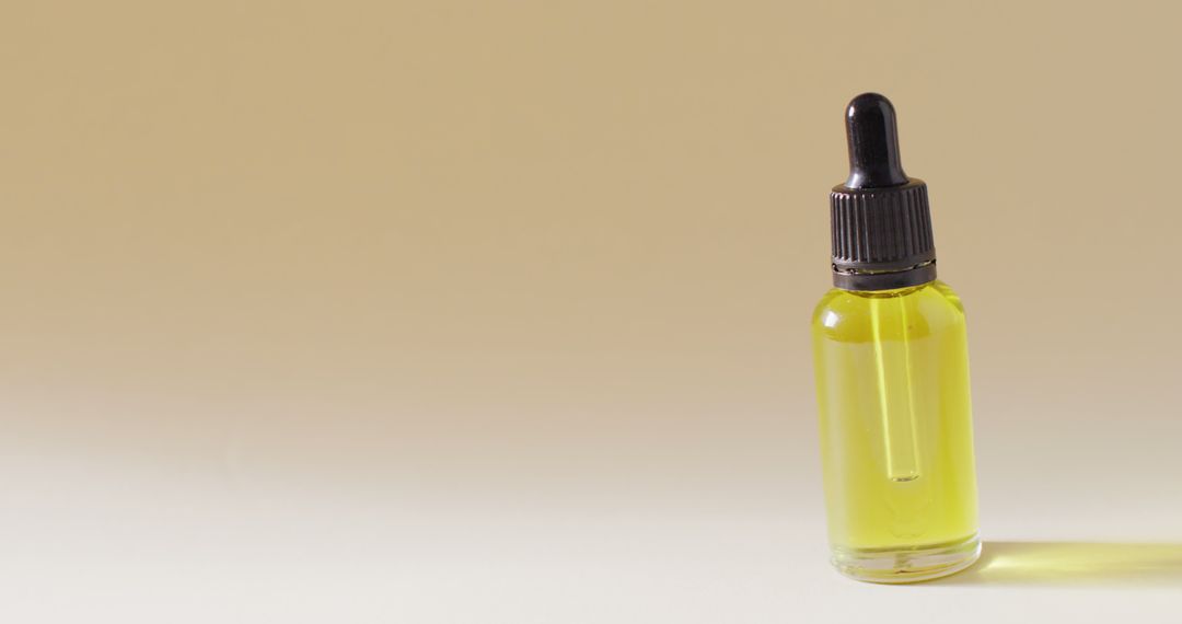 Minimalist Dropper Serum Bottle on Beige Background for Skincare