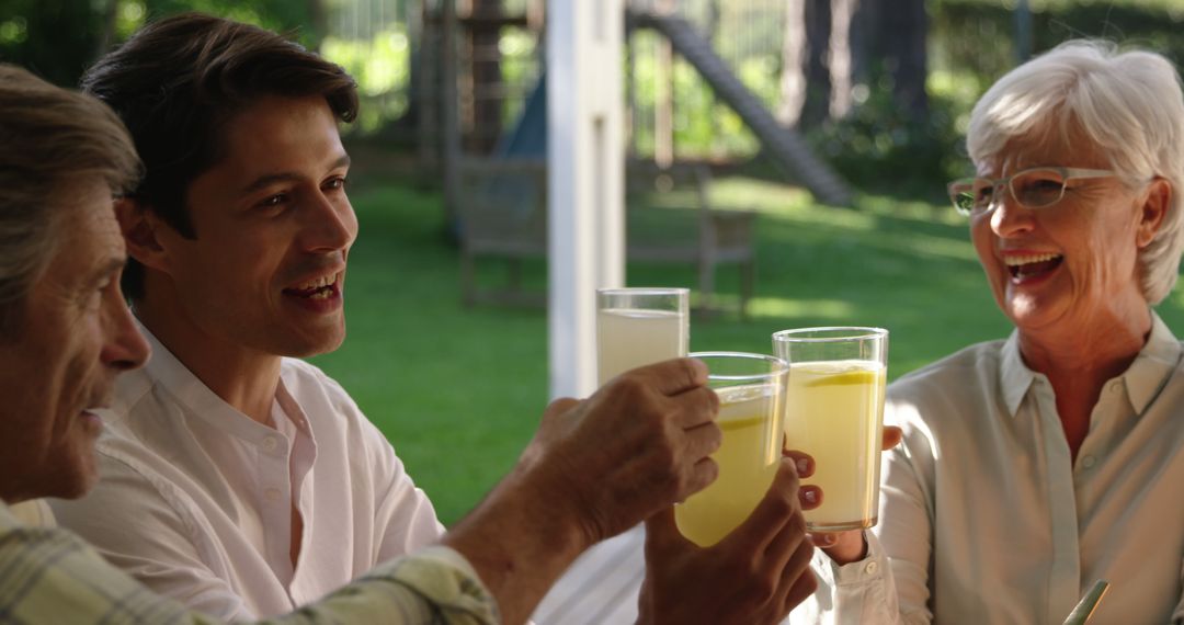 Happy Multi-Generational Family Toasting Lemonade Outdoors - Free Images, Stock Photos and Pictures on Pikwizard.com