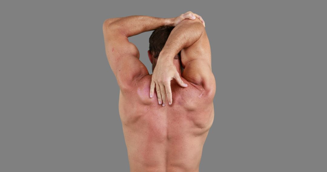 A Caucasian man appears to be stretching or experiencing back pain, with copy space - Free Images, Stock Photos and Pictures on Pikwizard.com