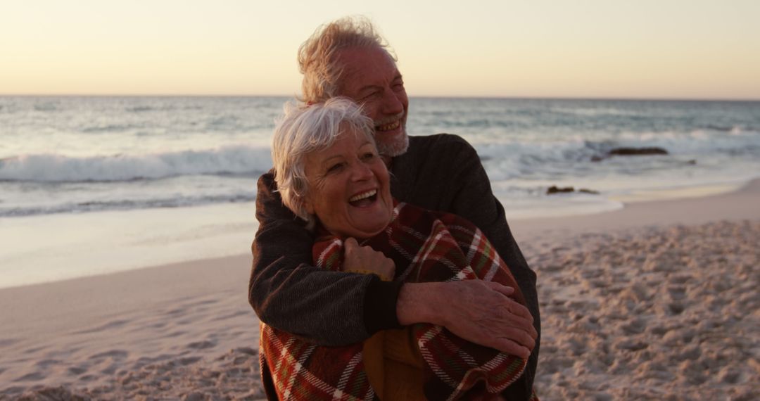 Senior Couple Hugging on Beach at Sunset - Free Images, Stock Photos and Pictures on Pikwizard.com