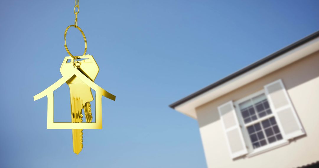 Golden Key with House Keychain Against Sky and Home - Free Images, Stock Photos and Pictures on Pikwizard.com