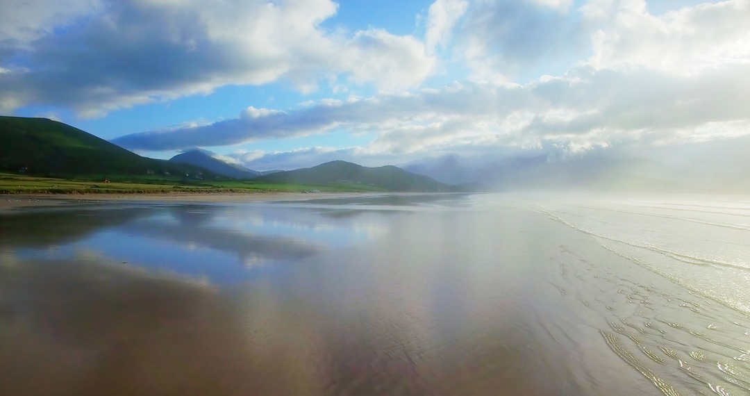 Tranquil Transparent Beach Scape with Reflective Shimmer Under Cloudy Sky - Download Free Stock Images Pikwizard.com