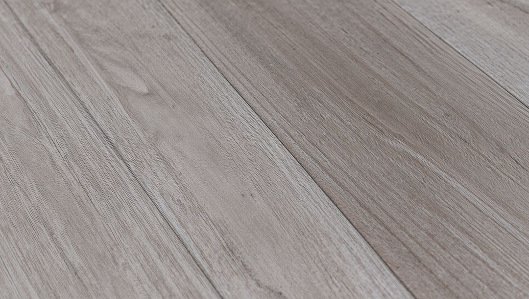Light Gray Brown Wood Plank Flooring Showing Subtle Grain, Knots and Matte Texture