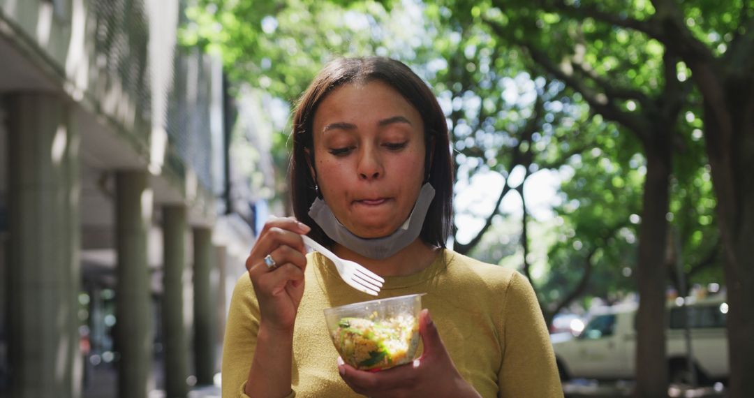 Woman Eating Salad Outdoors on Sunny Day - Free Images, Stock Photos and Pictures on Pikwizard.com