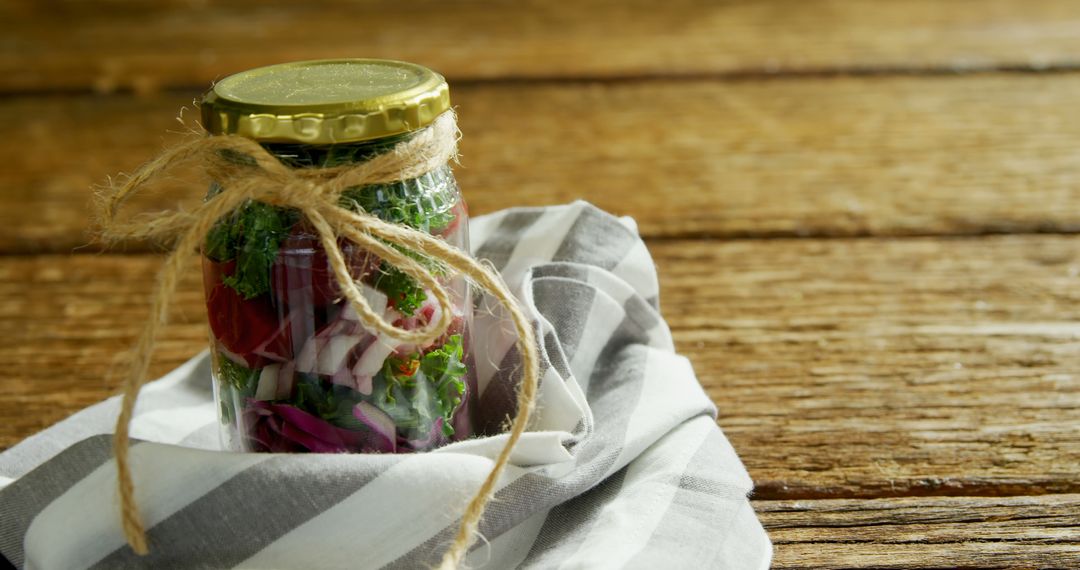 Fresh Veggie Salad in Jar with Twine on Rustic Wooden Table - Free Images, Stock Photos and Pictures on Pikwizard.com