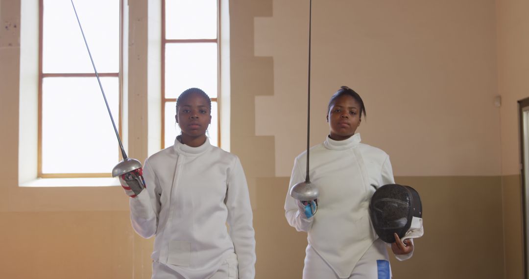 Two Confident Afro-Caribbean Women Fencers Ready for Practice - Free Images, Stock Photos and Pictures on Pikwizard.com