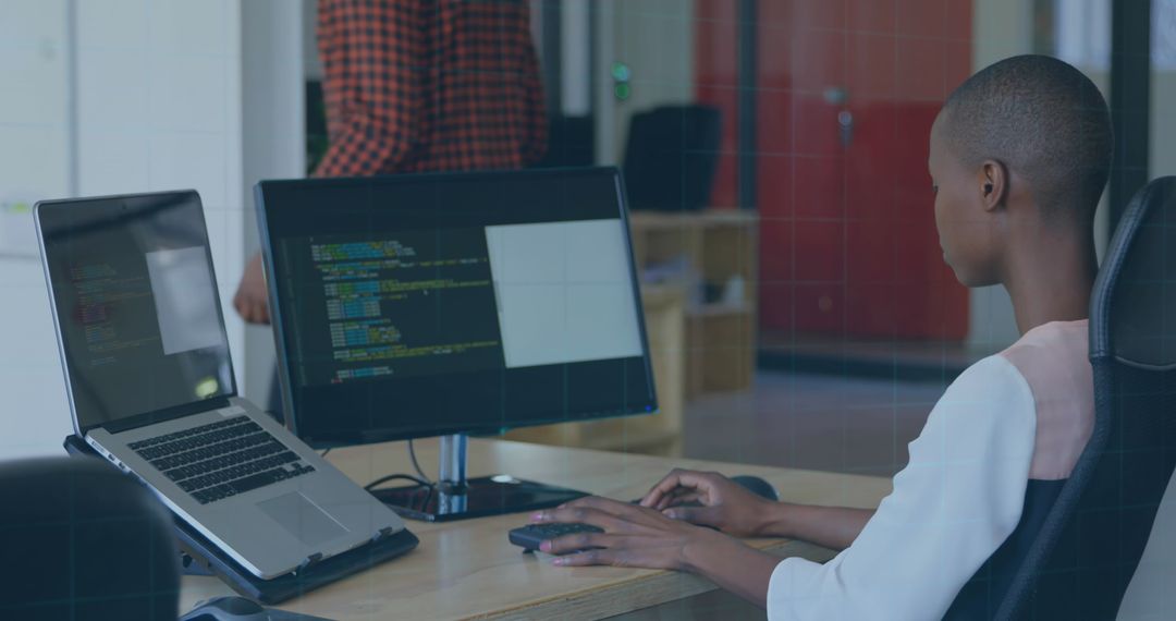 African American Intern Focusing on Coding in Office