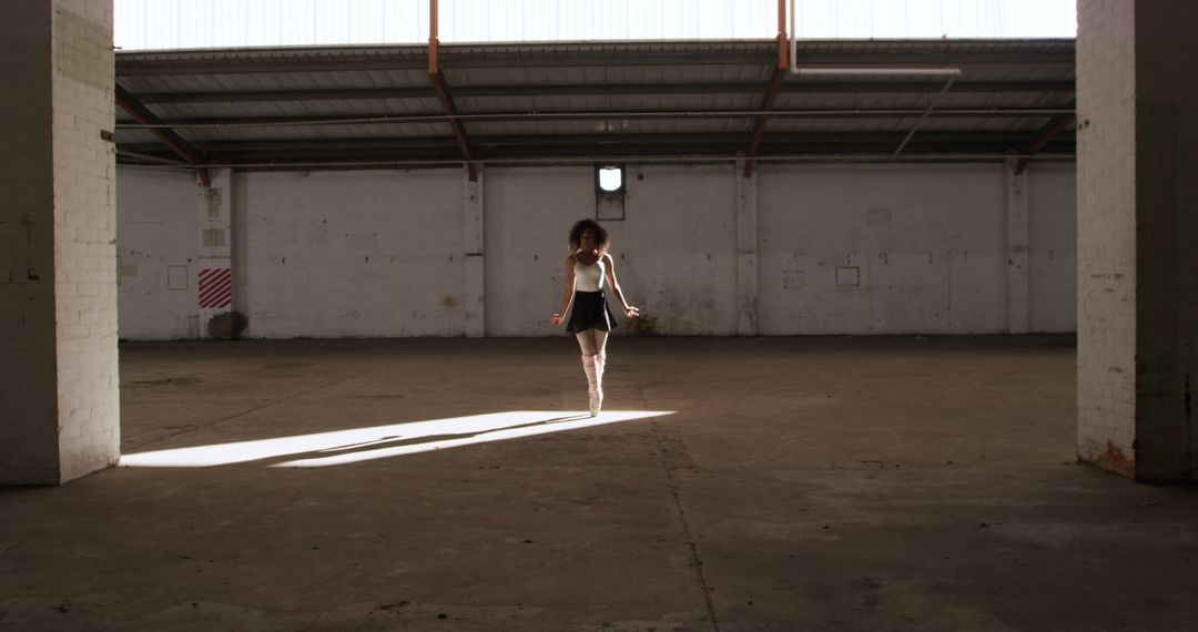 Woman Jumping Rope in Abandoned Industrial Warehouse - Free Images, Stock Photos and Pictures on Pikwizard.com