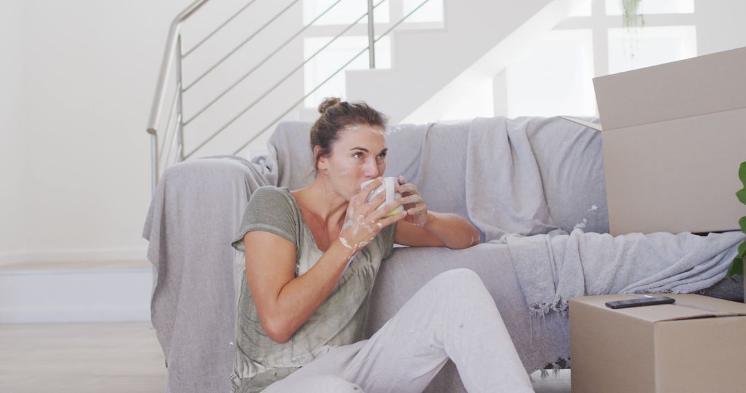 Woman Relaxing with Coffee During Home Renovation - Free Images, Stock Photos and Pictures on Pikwizard.com