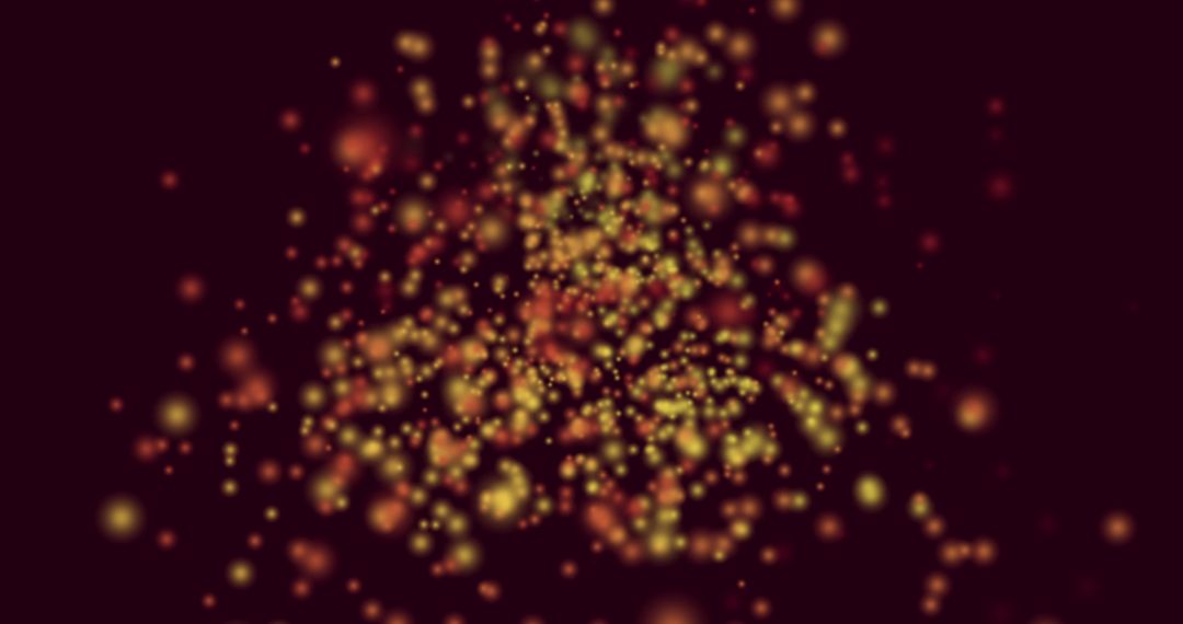 Abstract Yellow and Red Light Particles on Black Background