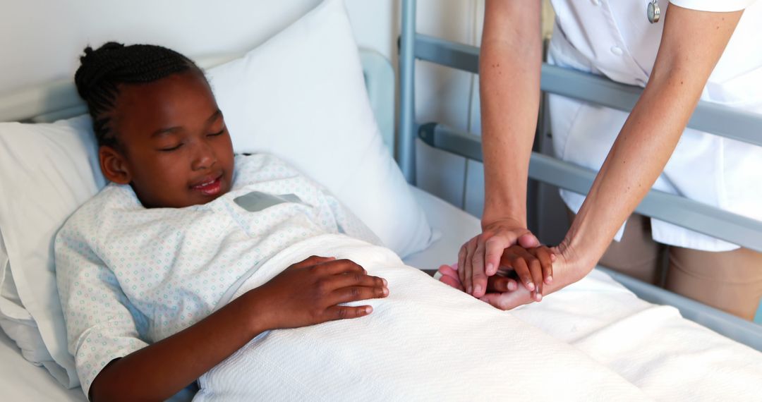 Nurse comforting young girl in hospital bed - Free Images, Stock Photos and Pictures on Pikwizard.com