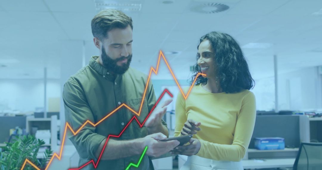 Two Colleagues Analyzing Financial Growth with Digital Graphs in Office