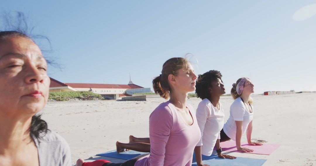 Diverse Women Practicing Yoga on Beach - Free Images, Stock Photos and Pictures on Pikwizard.com