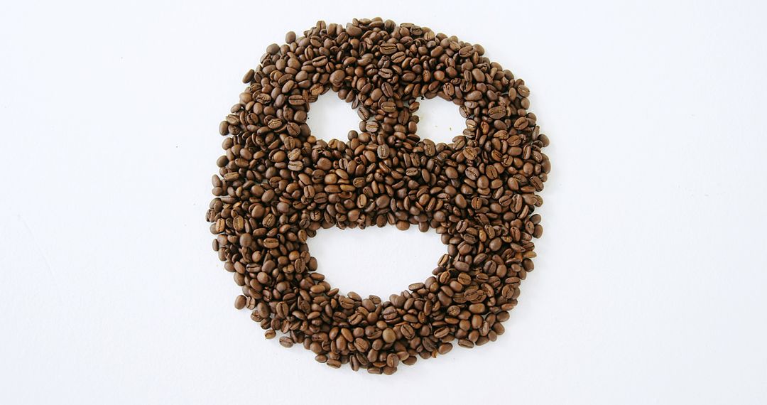 Face Shape from Coffee Beans on White Background - Free Images, Stock Photos and Pictures on Pikwizard.com