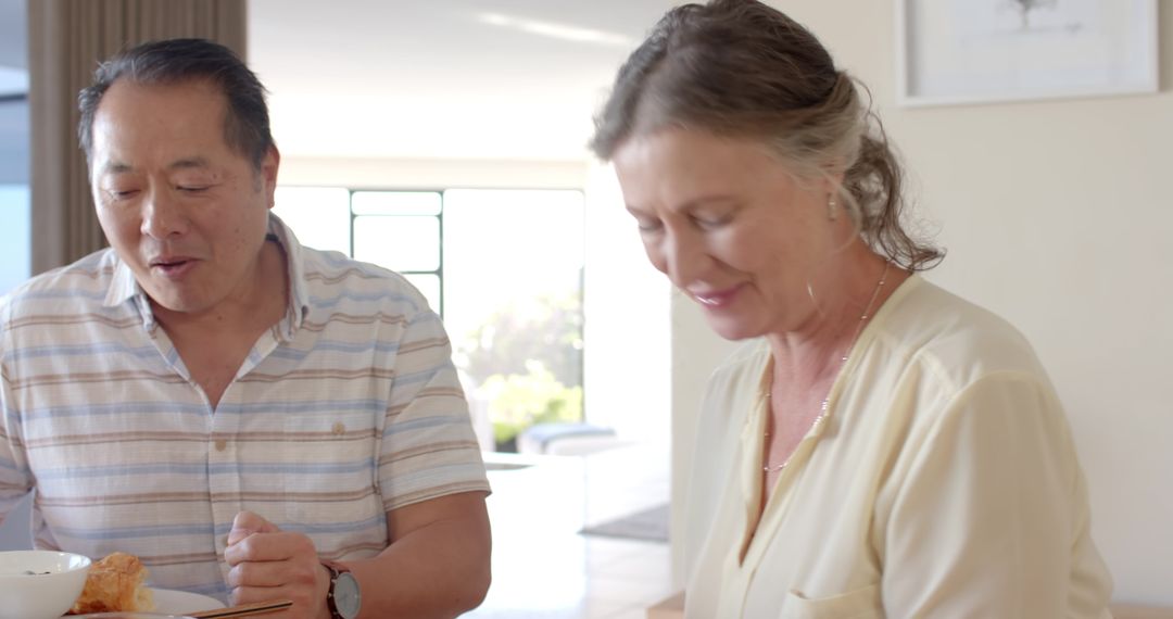 Diverse Senior Couple Enjoying Intimate Breakfast at Home