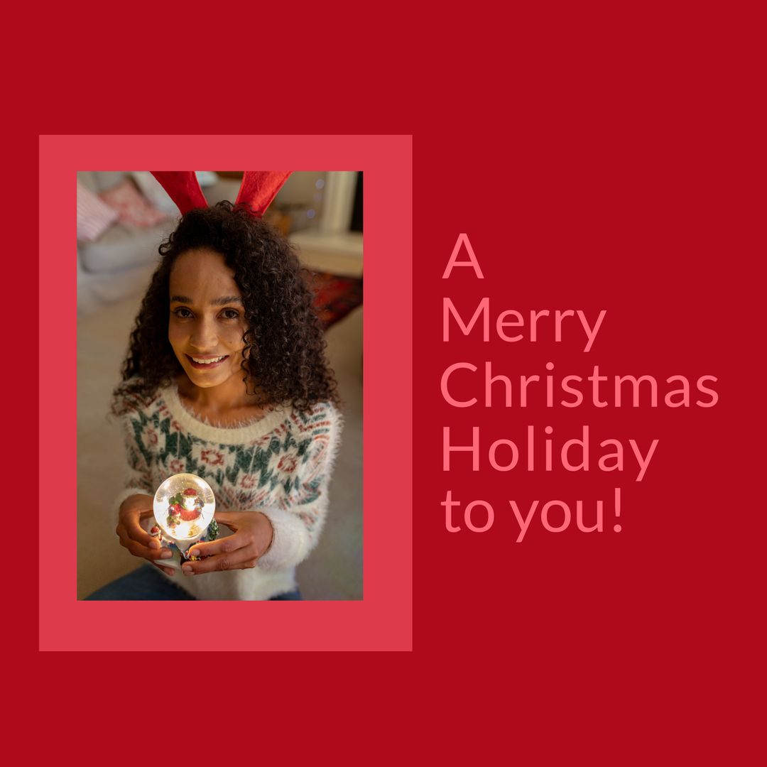 Christmas Greetings with Biracial Woman Holding Snow Globe on Red Background - Download Free Stock Templates Pikwizard.com