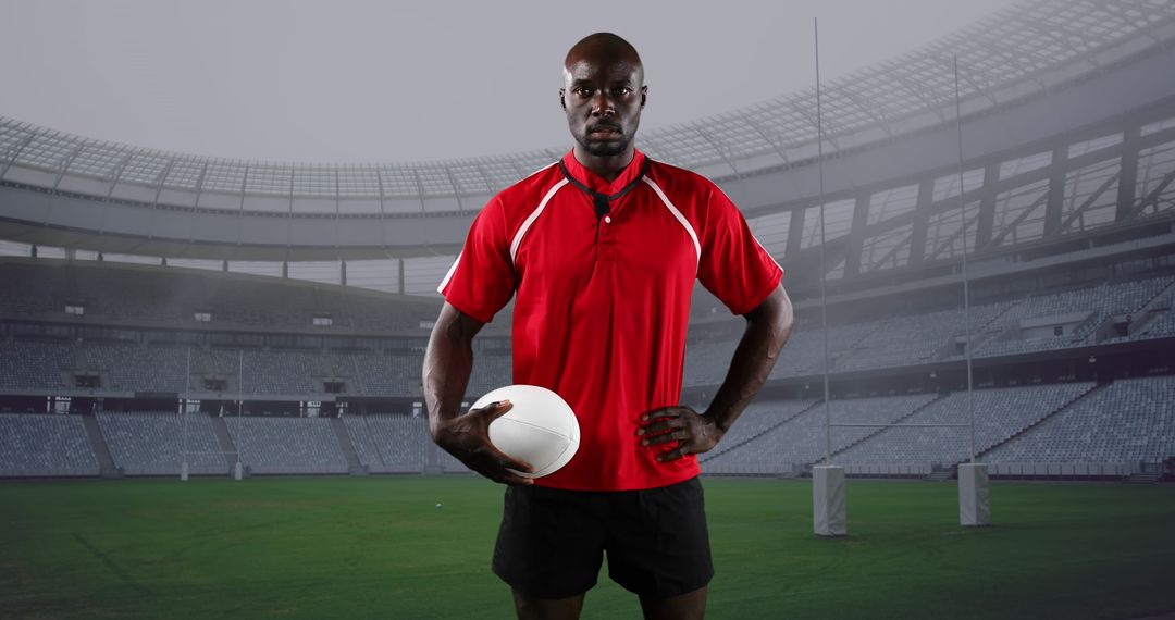 Rugby Player Posing Confidently in Stadium with Ball