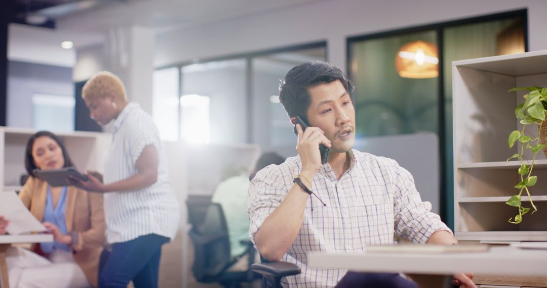 Professional Man Communicating on Smartphone in Modern Office