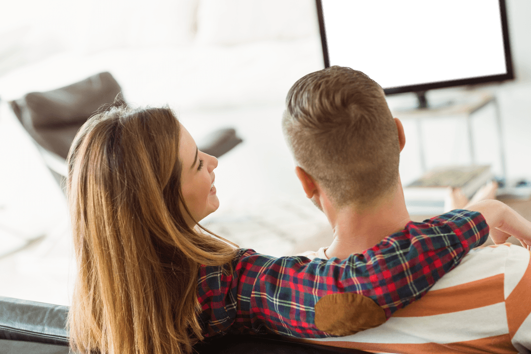 Cute Couple Relaxing at Home with Transparent Space for Screen Content