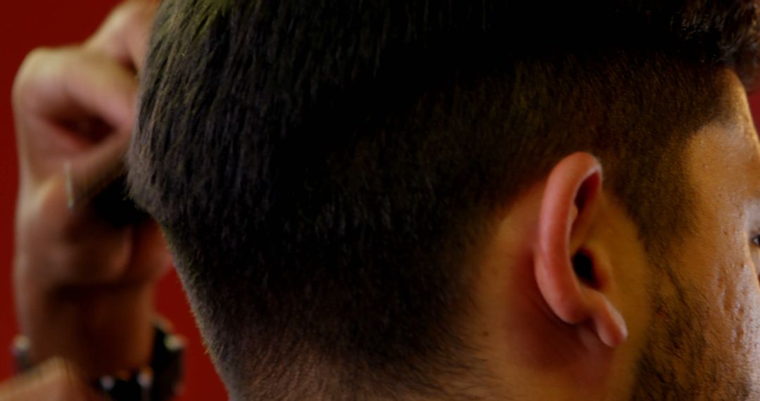 Close-Up of a Barber Cutting Hair with Clippers - Free Images, Stock Photos and Pictures on Pikwizard.com