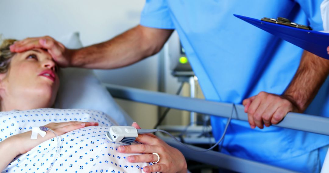 Pregnant Woman in Labor with Medical Staff at Hospital - Free Images, Stock Photos and Pictures on Pikwizard.com